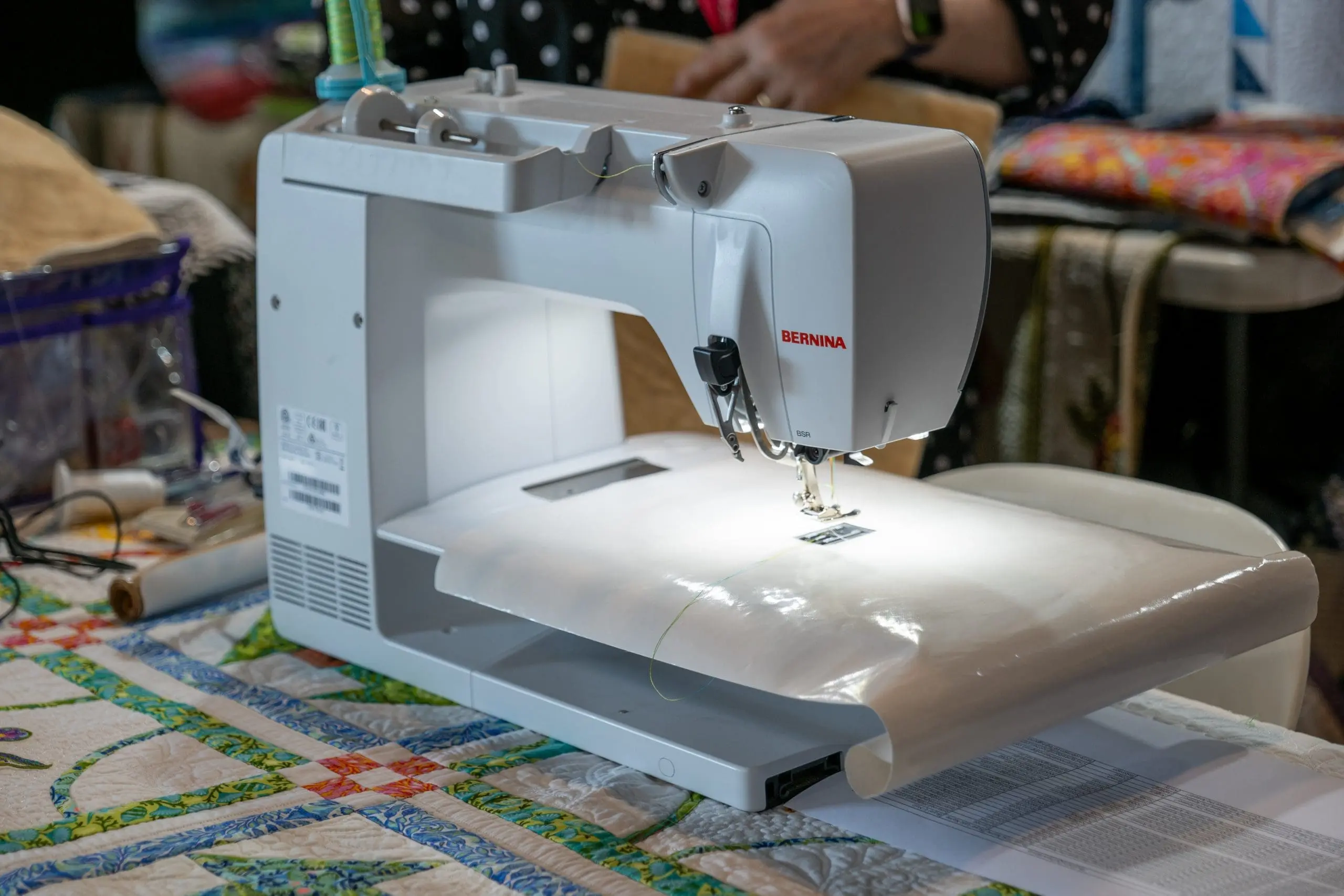 Sewing machine with QISS quilting tools and notions